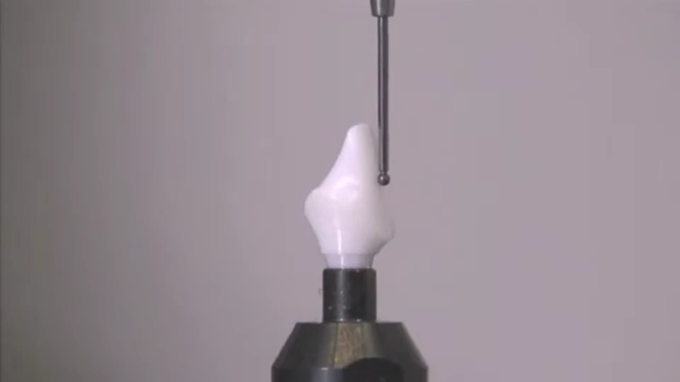 Precision probe approaching a dental restoration